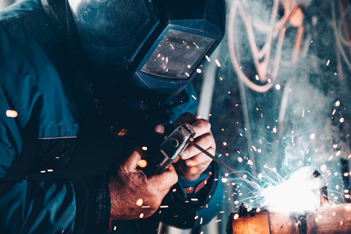 Close-up of hands repairing an electronic device