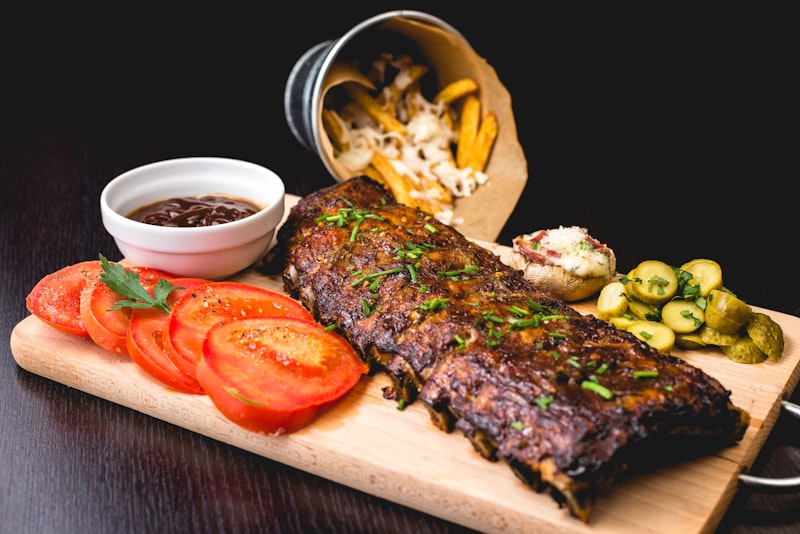 Meat thermometer inserted into steak showing internal temperature